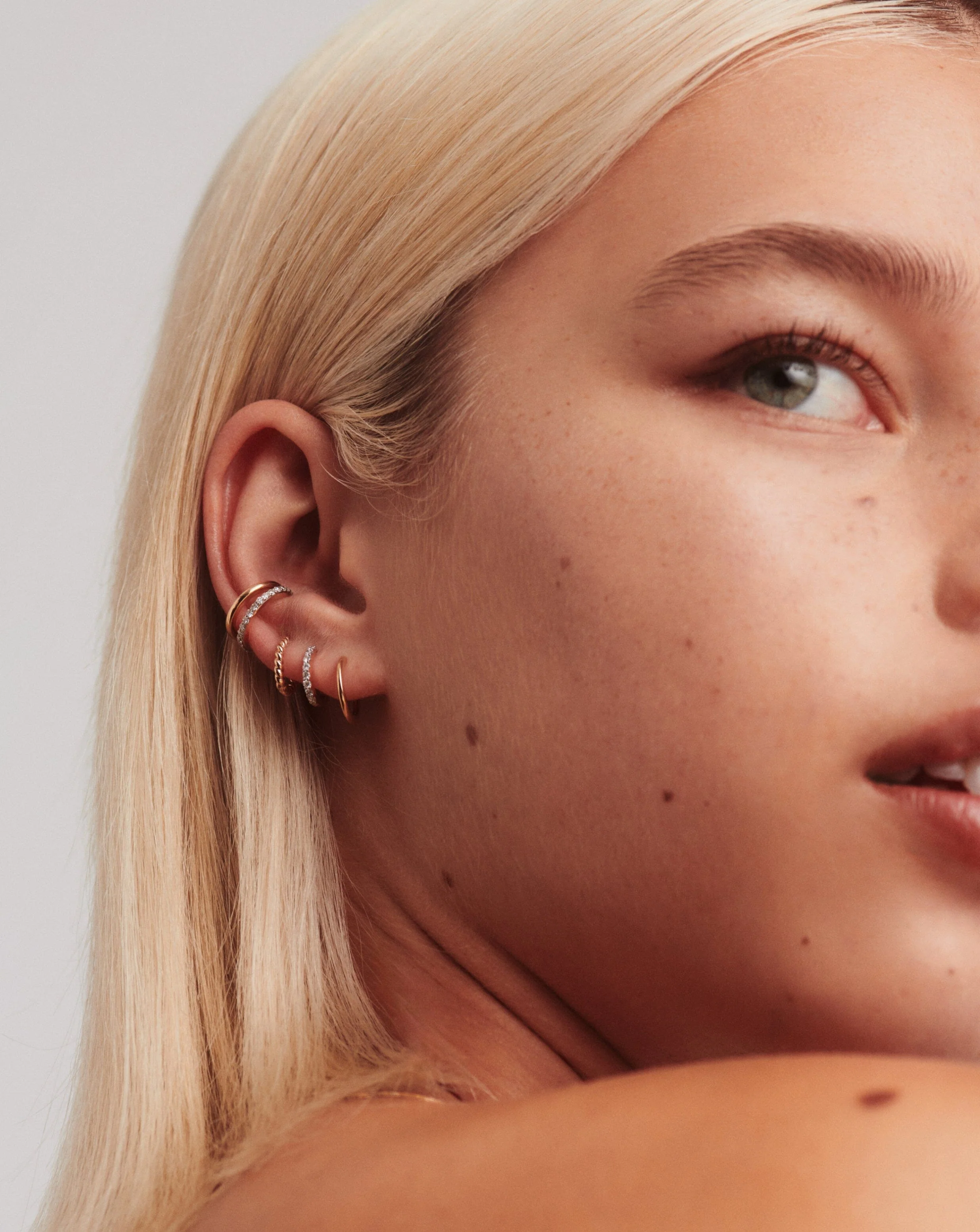 Solid Gold Classic Mini Hoop Earrings - Image 2