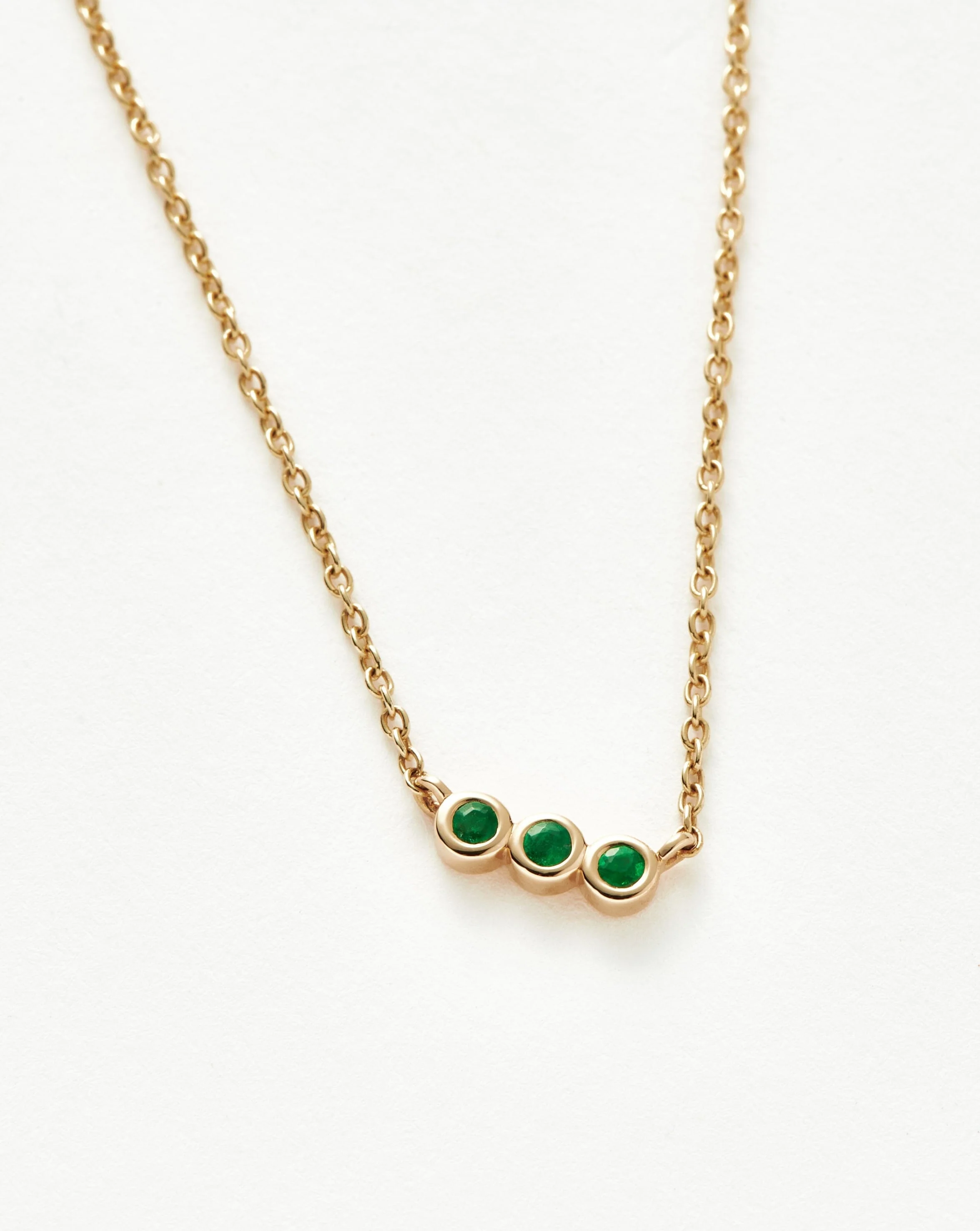 Solid Gold Emerald Solitaire Trio Necklace - Image 4